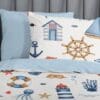Maritiem beddengoed met zeeprint en nautische symbolen.
